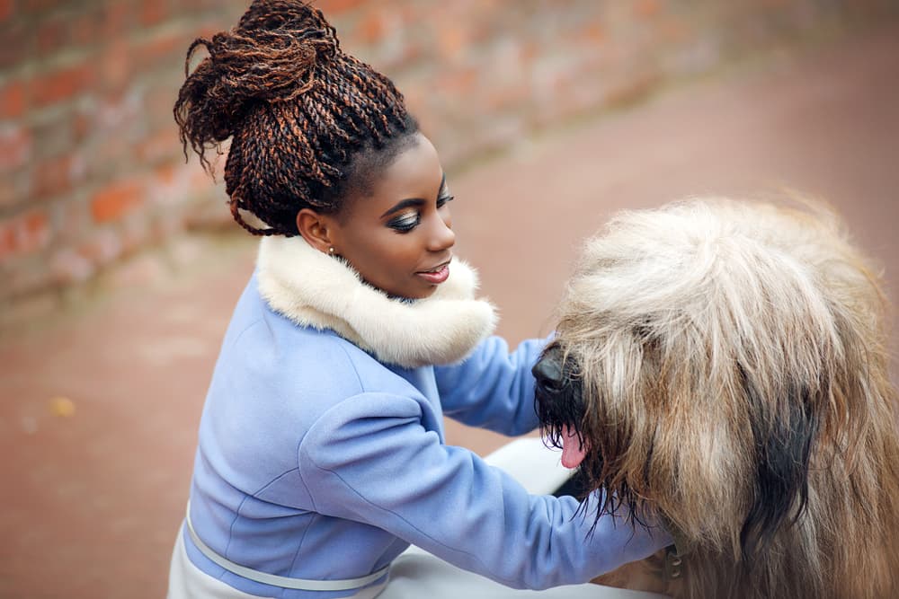 woman walking outside with dog