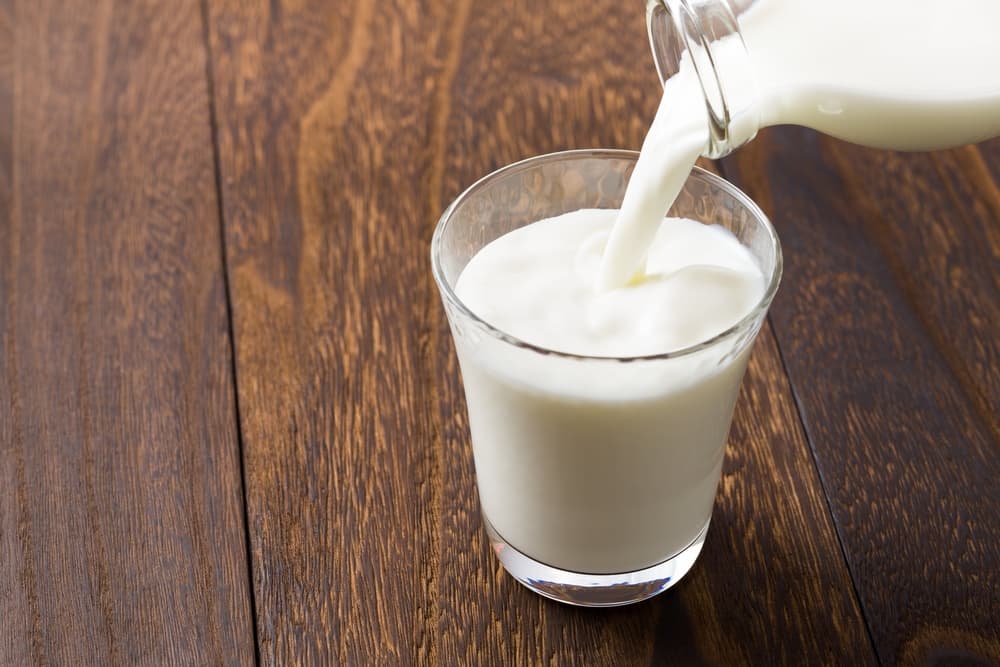 Glass of milk being poured