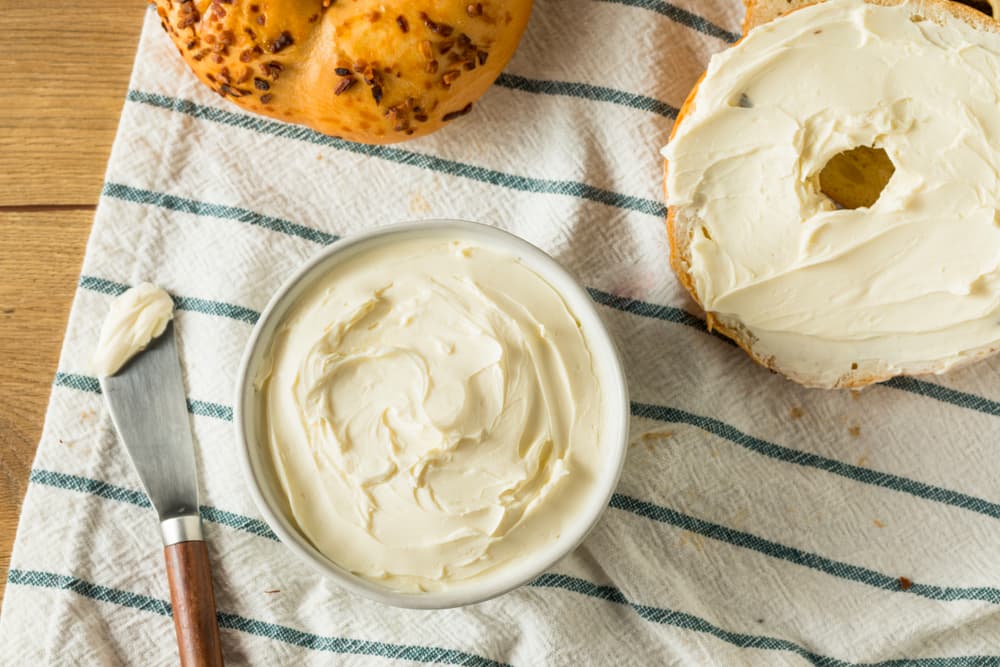 Bowl of cream cheese and knife