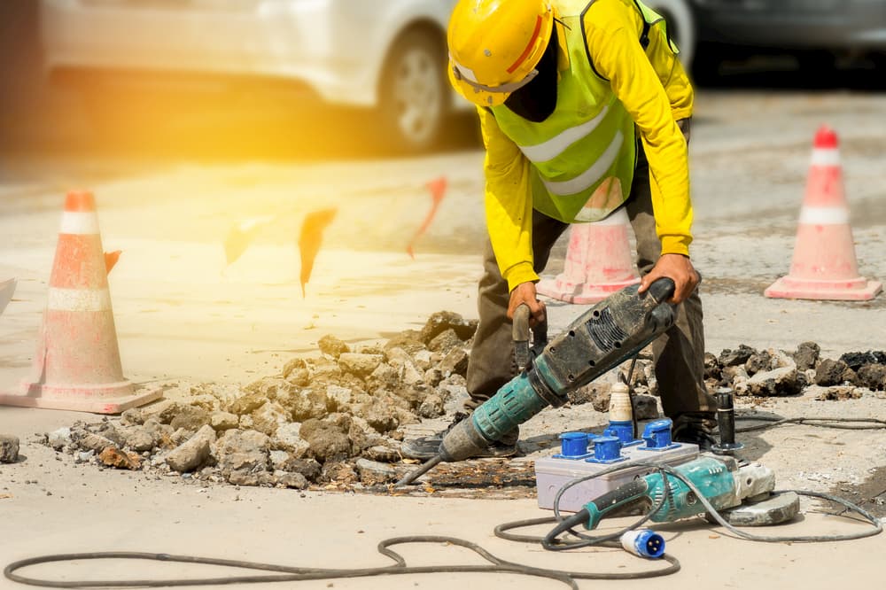 Jackhammering construction worker in the street