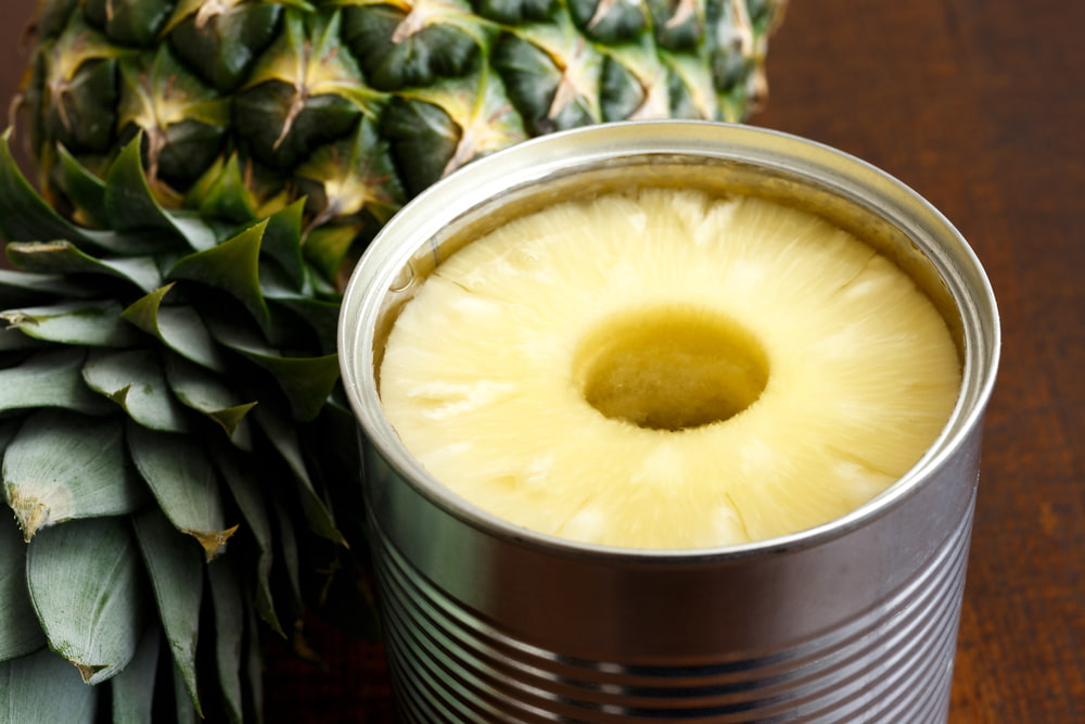 canned pineapple on table