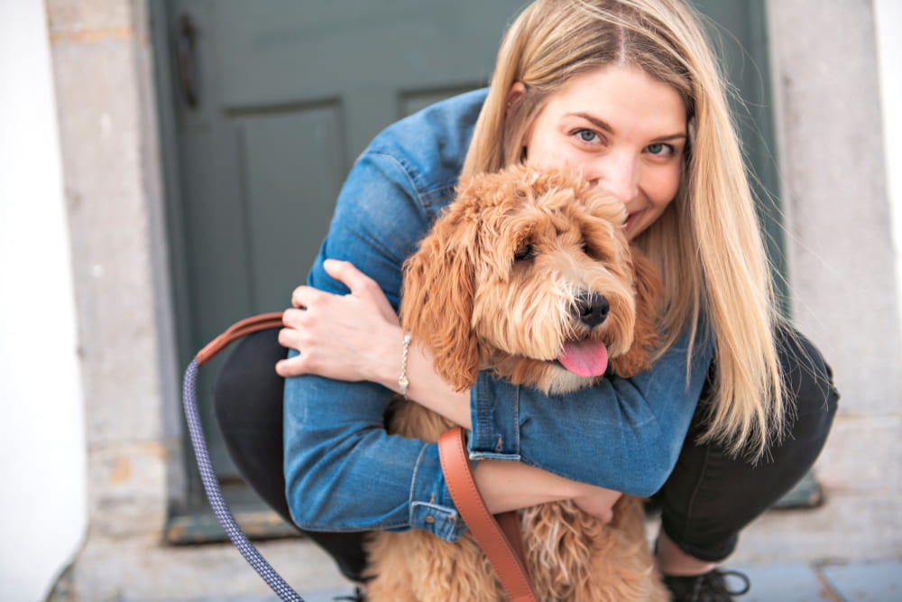 Woman with adopted Labradoodle