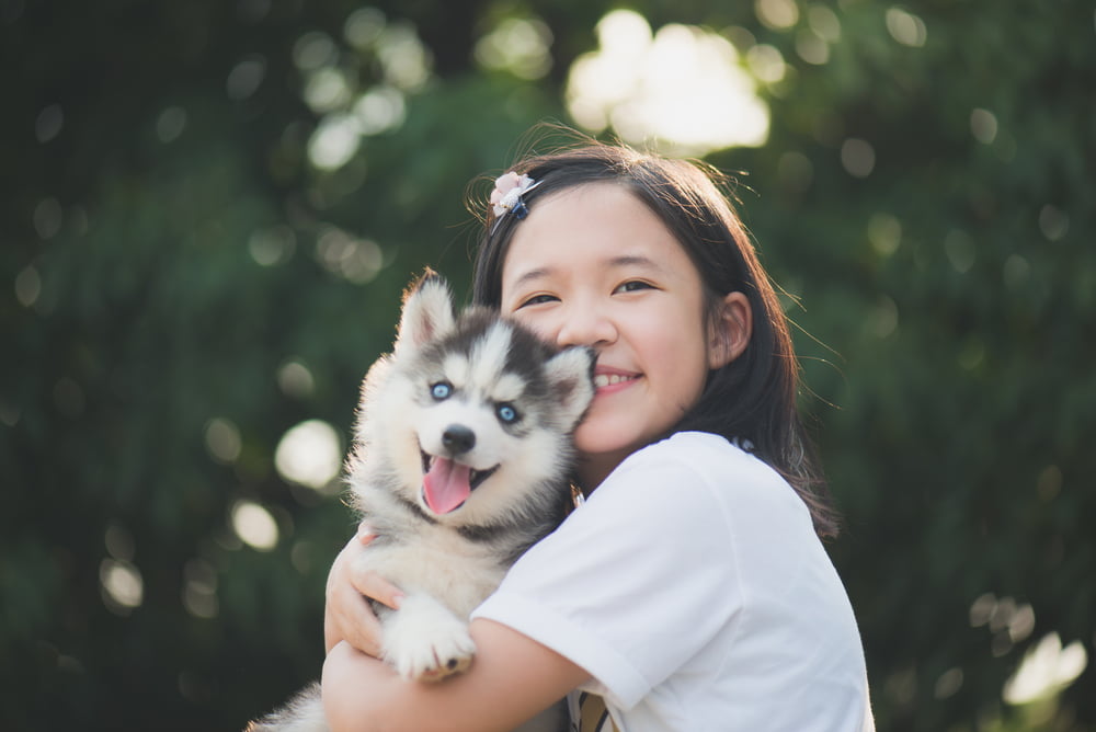 Japanese girl holding dog