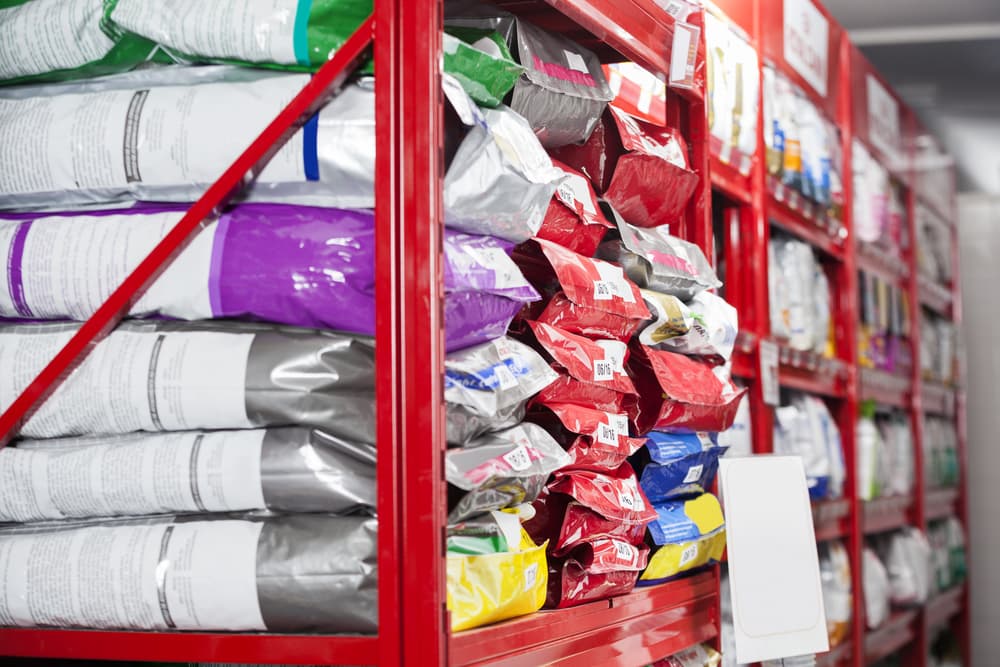 Bags of dog food on shelf