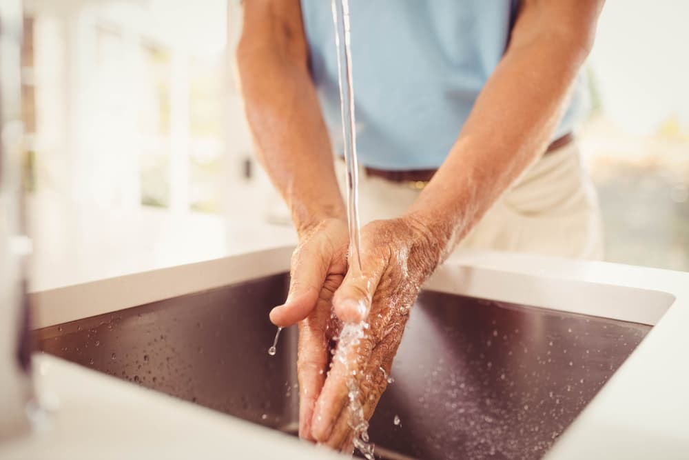 Washing hands to ensure cat food safety