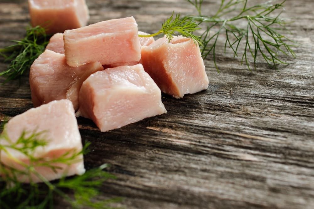 raw chicken on wooden table