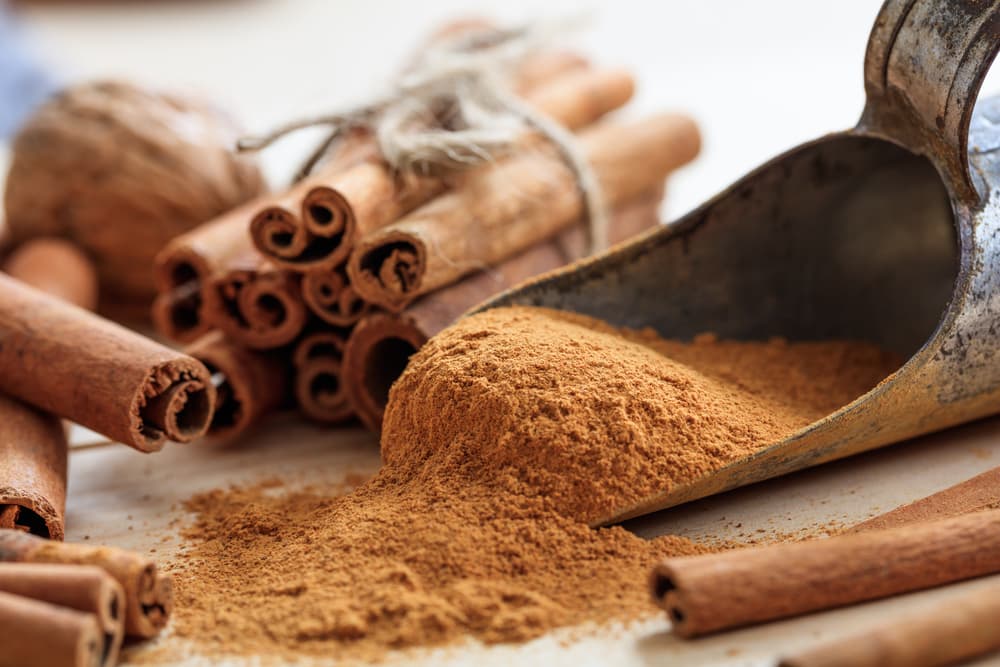 ground cinnamon and cinnamon sticks
