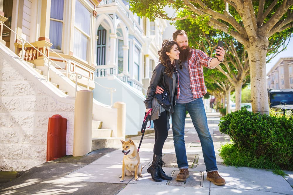Happy couple with their dog in San Francisco