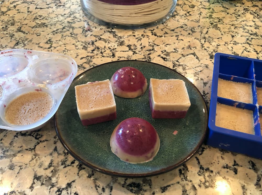 Frozen berry dog treats on table