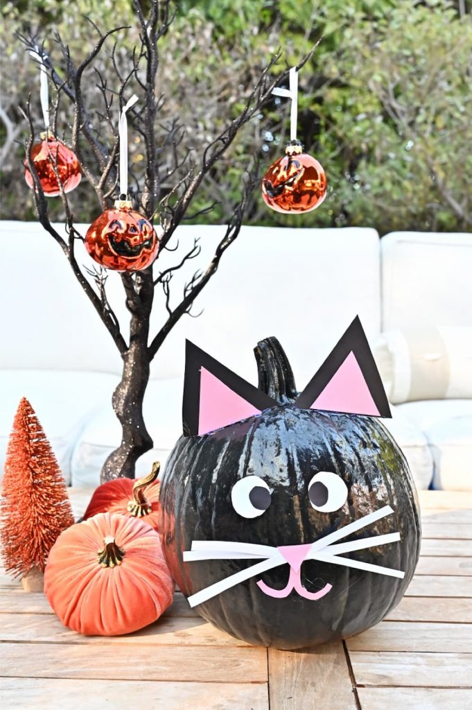 Black painted construction paper pumpkin