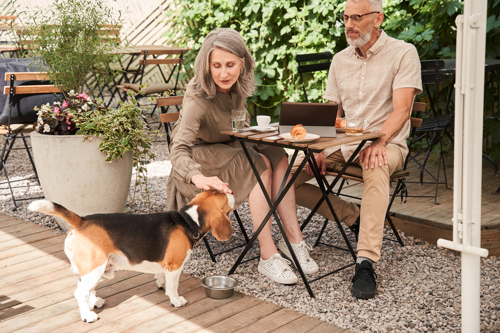 Dog sitting with couple